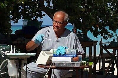 Image of Dr. Alfred Stines teaching dental care